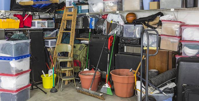 Cluttered garage filled with miscellaneous household items