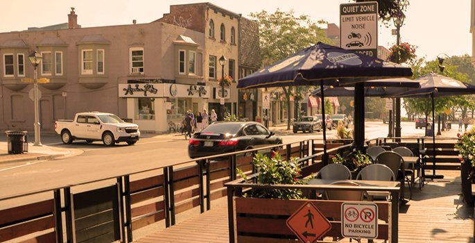 Image of a patio on Brant street out front of a restaurant during sundown