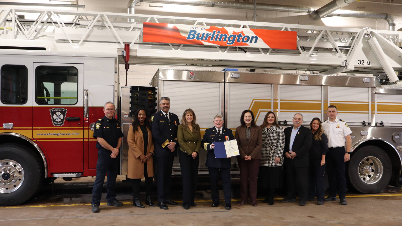 Image of City staff and government officials in front of Burlington Fire Truck