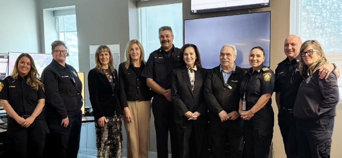 Image of Burlington Fire Department staff and government officials in Burlington communications centre