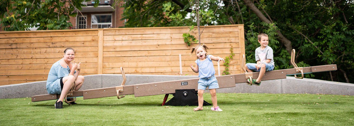 Happy children on seesaw