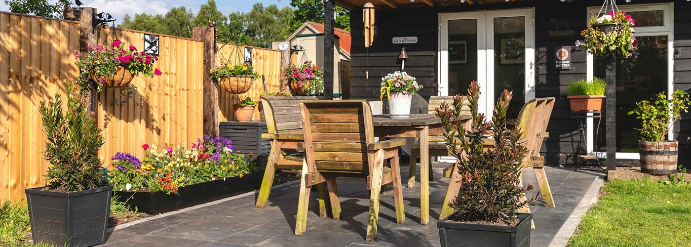 Banner - City receives federal funding to support short-term rental enforcement Sunny backyard patio as part of a short term rental space