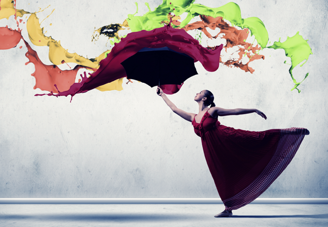 Burlington Arts and Culture Grant Artistic dancer posing while throwing paint