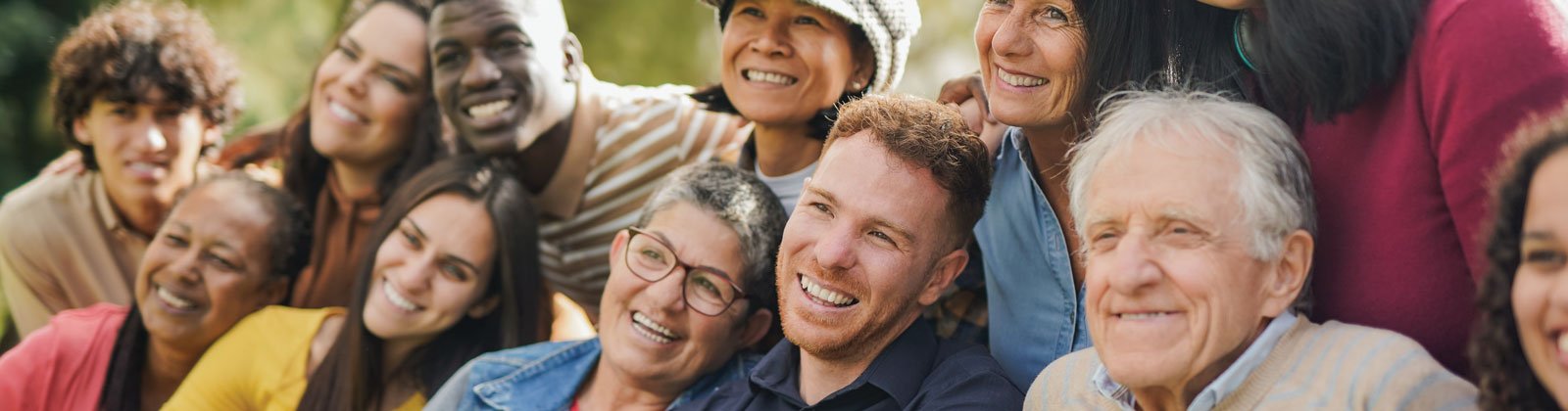 Photo of a large group of diverse, happy, smiling adults