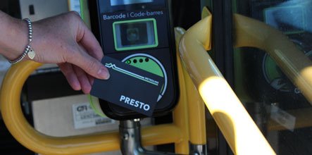 Person tapping their presto card for planned transit trip.